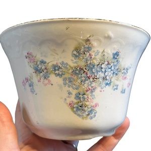 Vintage bowl with gold rim painted and flowers on it, 3in bottoms, 5in opening